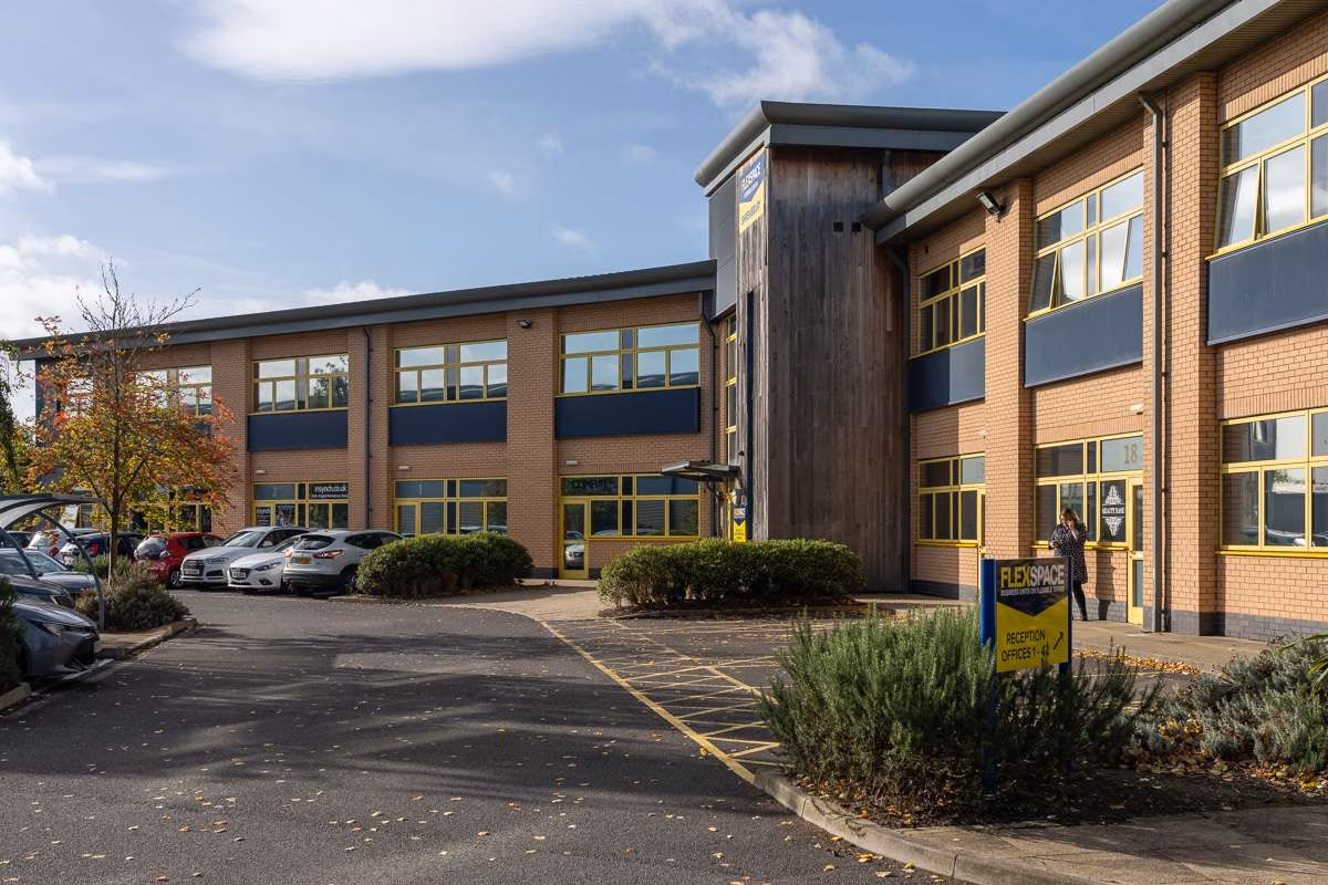 The car park at FlexSpace, Shrewsbury, with the FlexSpace pole sign and the timber-clad entrance tower