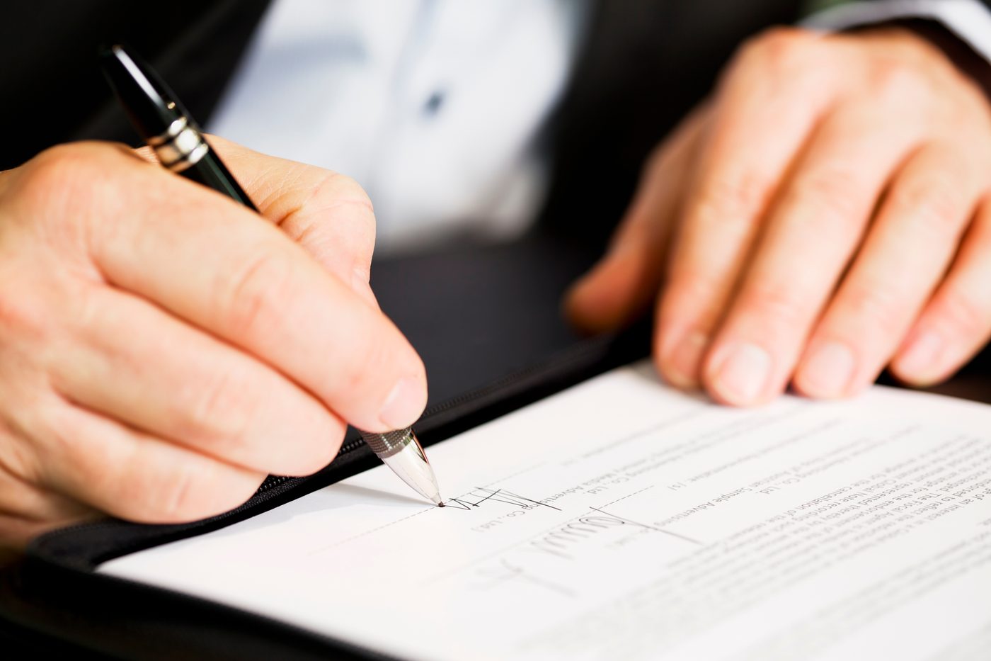 Signing a document with a fountain pen