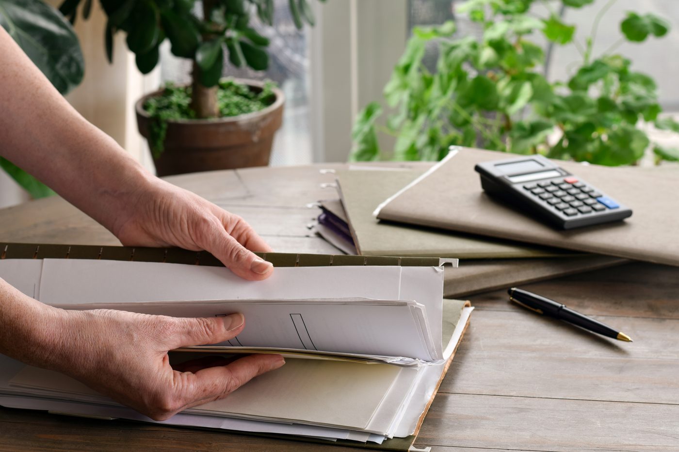 Property paperwork and a calculator on a desk